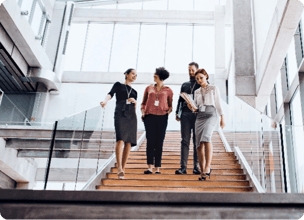 A group of people walking down a staircase